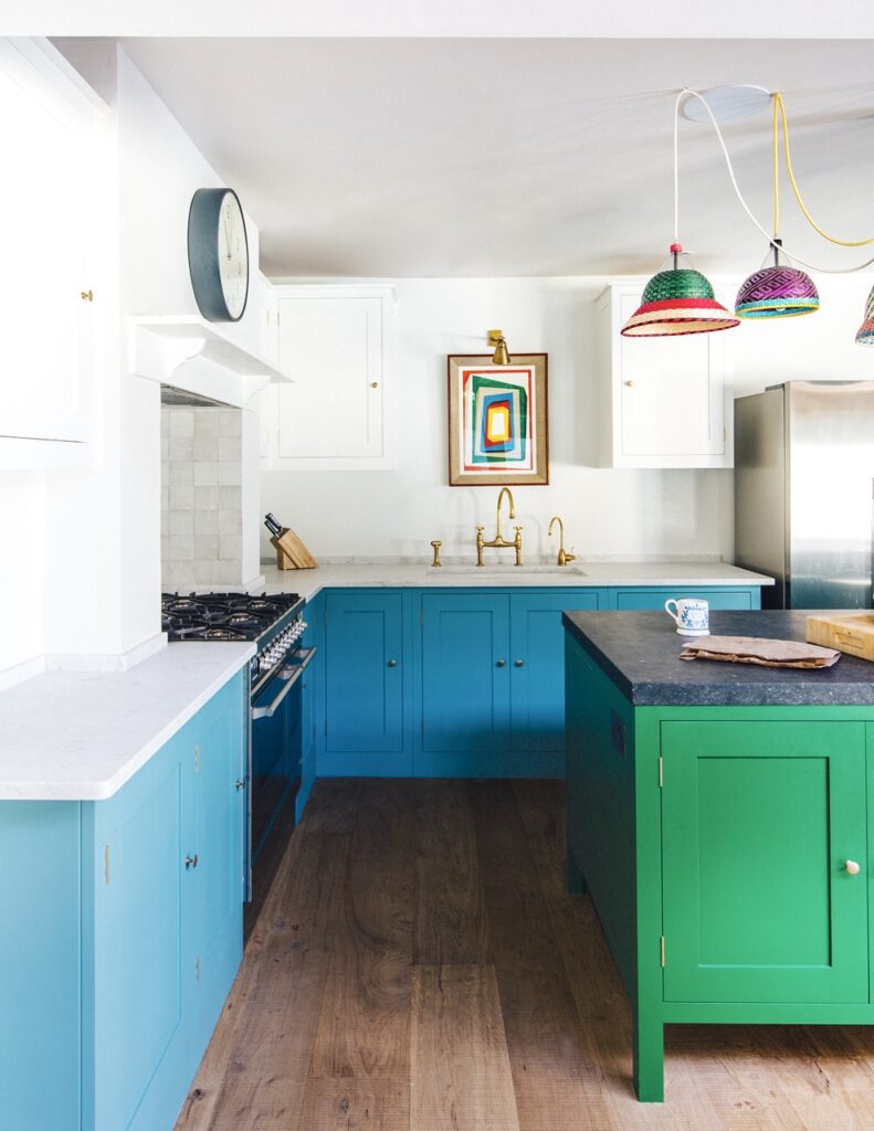 Floor cupboard painted in a light blue with kitchen island painted in Pickle green and white top cabinets