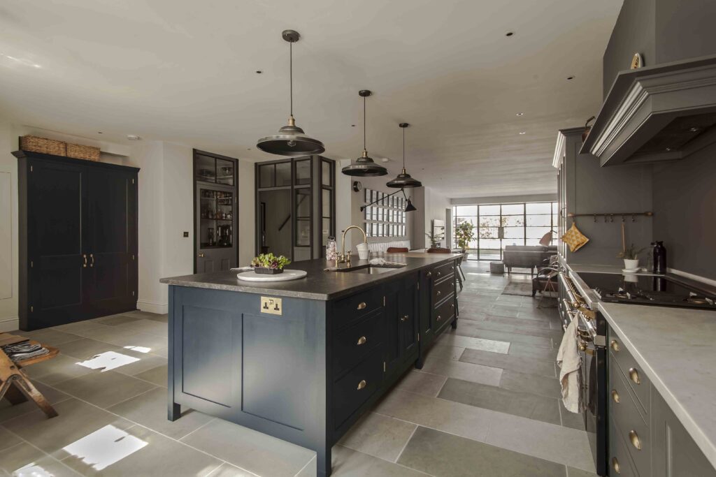 Osea Island painted in Inky Nib to complement bespoke kitchen design with tall and floor cupboards painted in Draughty Passage